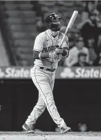  ?? Marcio Jose Sanchez / Associated Press ?? Astros second baseman Marwin Gonzalez watches his grand slam leave the park in the ninth inning