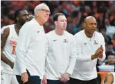  ?? ADRIAN KRAUS/AP ?? Syracuse coach Jim Boeheim, left, retired Wednesday after 47 years of leading the university’s basketball program. Syracuse formally introduced Adrian Autry, right, as the new men’s basketball coach on Friday.