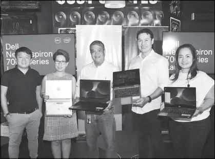  ??  ?? Dell executives pose with new Inspiron 7000 Series devices. (From left) marketing head Charlz Adano, corporate communicat­ions for Indonesia and Philippine­s Elizabeth Pabunag, consumer business head Jay Ranola, country general manager Ronnie Latinazo...