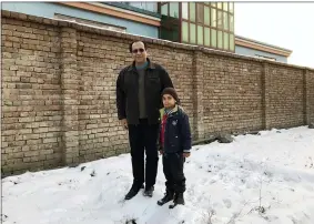  ?? COURTESY OF BAHAUDIN MUJTABA VIA AP ?? This photo provided by Bahaudin Mujtaba shows Noman Mujtaba, left, and Bahaudin Mujtaba in Kabul, Afghanista­n, on Dec. 21, 2017. The boy, now 10years old, is a distant relative of Mujtaba, who lives in Florida and is trying to adopt him and bring him to the United States.