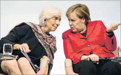  ?? NURPHOTO / GETTY ?? Christine Lagarde y Angela Merkel, durante una cumbre paralela del G-20 en Berlín en el 2017