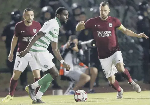  ??  ?? 0 Celtic’s Odsonne Edouard takes on Krste Velkoski of FK Sarajevo during the Champions League first round first leg qualifier.