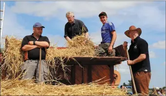  ??  ?? Darragh Murray, Anthony Murray, and David Barry, Carrignava­r, with John Casey, Macroom, working on one of the many displays of old time Farm Machinery. ALL PHOTOS BY SHEILA FITZGERALD