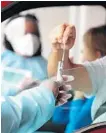  ?? MIKE STOCKER/ SOUTH FLORIDA SUN SENTINEL ?? Health care workers collect samples at a testing site at the MiamiDade County Auditorium in Miami on July 23.