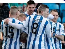  ?? ?? KING KYLE: Kilmarnock players congratula­te Lafferty (centre) after his first goal