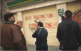  ??  ?? PEOPLE wait to enter a government job centre in Malaga, southern Spain. — Reuters