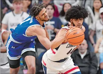  ?? JESSICA HILL/AP PHOTO ?? UConn’s Andre Jackson Jr., right, steals the ball from Seton Hall’s Tray Jackson during a Feb. 18 game in Storrs. The No. 14 Huskies play their final home game tonight at the XL Center in Hartford against DePaul.