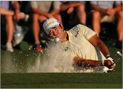  ??  ?? ABOVE Hideki Matsuyama hits out of a bunker to the 18th green during the final round of The Masters on Sunday in Augusta, Ga. Matsuyama closed with a 1-over 73 for a one-shot victory over Will Zalatoris to become the first Japanese winner of the event.