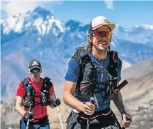  ?? Picture: DEAN LESLIE – THE WANDERING FEVER/RED BULL CONTENT POOL ?? MOUNTAIN MILESTONE: Ryan Sandes leads Ryno Griesel on their recordbrea­king Great Himalayan Trail