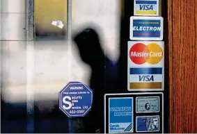  ?? Associated Press file photo ?? About 4.5 percent of U.S. households lacked a bank or credit union account as of last year, the FDIC said, the lowest level in a survey that began in 2009.