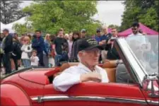  ?? PHOTOS BY ANNE NEBORAK – DIGITAL FIRST MEDIA ?? Above, during the “Star Spangled Banner” the crowd stood during the Walk for the Wounded Ceremony. At right, riding in the parade is World War II Veteran, Jim Gullborg, 92, of Newtown Square.