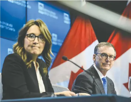  ?? JUSTIN TANG/THE CANADIAN PRESS ?? Bank of Canada senior deputy governor Carolyn Rogers, left, and Tiff Macklem, the Boc’s governor, talk to media in Ottawa Thursday after the release of the central bank’s annual Financial Stability Report, a gauge on Canada’s financial system.