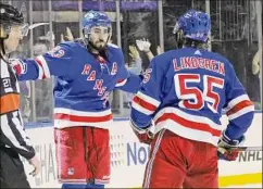  ?? Bruce Bennett / Getty Images ?? The Rangers’ Mika Zibanejad, left, celebrates his second-period goal against Carolina in Game 4 on Tuesday night in New York.