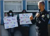  ??  ?? Retiring Vacaville Police Chief, John Carli addresses the students, faculty, and staff of Kairos Public School Vacaville Academy Tuesday during a special assembly held to honor his service to the city.