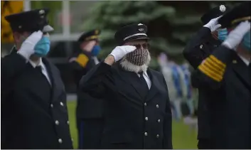  ?? PETE BANNAN - MEDIANEWS GROUP ?? Collingdal­e firefighte­rs salute after placing wreaths honoring the dead during the annual Memorial Day ceremony.