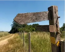  ??  ?? The cracked and sun-bleached signpost near Houghton Hall.