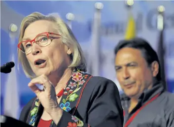  ?? MARK TAYLOR/THE CANADIAN PRESS ?? Minister of Indigenous and Northern Affairs Carolyn Bennett speaks as AFN National Chief Perry Bellegarde looks on at the Assembly of First Nations annual general meeting in Regina, Sask., last week. Bennett says she’s troubled by reports of Indigenous...