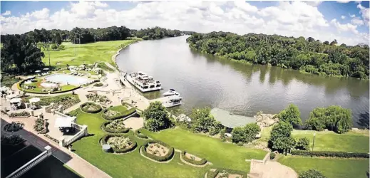  ??  ?? The hotel’s serene setting along the Vaal River where one can ride on a speedboat, water ski or go parasailin­g.