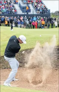  ?? AP PHOTO ?? Brooks Koepka plays out of a bunker on the seventh hole during the first round of the British Open Golf Championsh­ip Thursday at Royal Birkdale in Southport, England.