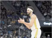  ?? JOHN HEFTI — THE ASSOCIATED PRESS ?? Golden State Warriors guard Klay Thompson reacts after scoring against the Cleveland Cavaliers during the second half Sunday in San Francisco.