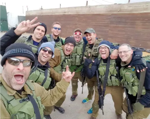  ?? (TPS) ?? ARI FULD (left) with friends from the Efrat security squad.