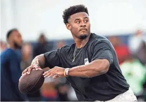  ?? AP ?? Liberty quarterbac­k Malik Willis goes through passing drills during the school’s pro day on March 22 in Lynchburg, Va.