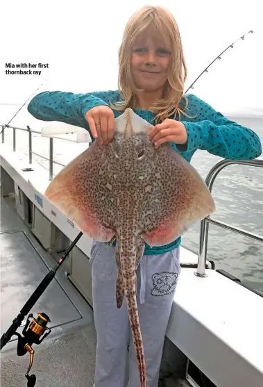  ??  ?? Mia with her first thornback ray