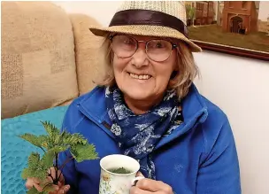  ?? ?? ●●Chris Worswick, dressed in blue for World Parkinson’s Day, with her cup of nettle tea.