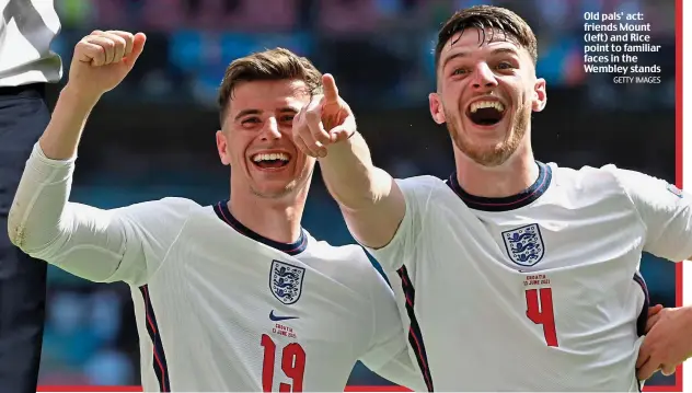  ?? GETTY IMAGES ?? Old pals’ act: friends Mount (left) and Rice point to familiar faces in the Wembley stands