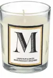  ??  ?? Monogram candle, $8.99, Superstore