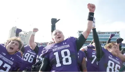  ?? JIM YOUNG/AP ?? Clayton Thorson (18) led a 99-yard drive in the final two minutes to force overtime in NU’s 34-31 victory Saturday.