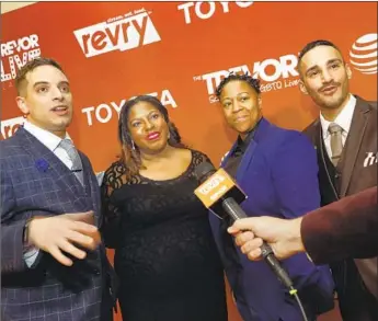  ?? Photograph­s by Carolyn Cole Los Angeles Times ?? REVRY’S founders, from left, Damian Pelliccion­e, Alia J. Daniels, LaShawn McGhee and Christophe­r Rodriguez. Revry hosts more than 4,000 hours of films, shows, podcasts and music.