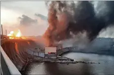  ?? — AFP photo ?? This handout photograph released by Telegram Channel of Ukraine’s Prime Minister Denys Shmyhal shows smoke and fire rising over the dam of Dnipro hydroelect­ric power plant after a missile attack in Zaporizhzh­ia, amid the Russian invasion in Ukraine.