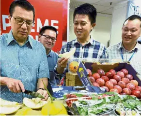  ??  ?? Fruitful visit: (From left) Liow, Chong and the conference director Ling Kah Chok visiting a booth at the 10 Economic Strategic Directions Conference and Exhibition.