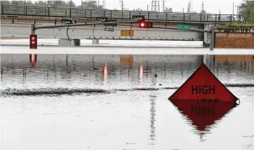  ?? Melissa Phillip / Chronicle files ?? The FM 529 underpass at Highway 290 near Jersey Village is submerged during the floods of April 18, dubbed the “Tax Day floods.” More gauges in neighborin­g counties could provide better warnings in the event of flooding conditions.