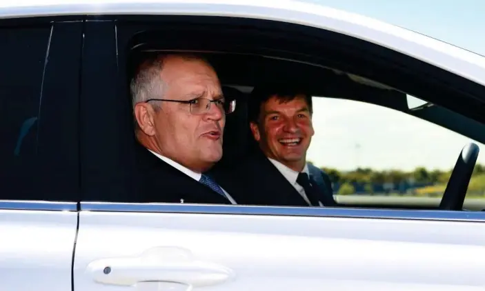  ?? Photograph: William West/AAP ?? Can prime minister Scott Morrison and emissions reduction minister Angus Taylor deliver what Australia has promised under the Cop26 climate pact?