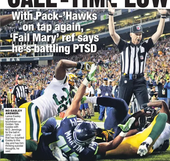  ??  ?? NO EASLEY ANSWER: Lance Easley signals a touchdown as Golden Tate tussles with M.D. Jennings for the ball in 2012 — a call that has haunted Easley to this day and has him thinking suicidal thoughts, he said.