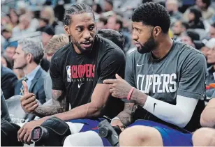  ?? DARREN ABATE THE ASSOCIATED PRESS FILE PHOTO ?? Kawhi Leonard, left, and Paul George, the two best players on the Los Angeles Clippers, were ruled out for Tuesday’s game in Atlanta because of the league’s health and safety protocols.