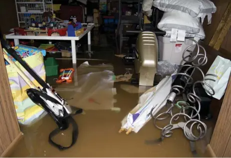  ?? DAVE ROBERTS ?? Toys, tools, home appliances and decor items were among the possession­s ruined by the sewer water that flooded the basement in August 2014.