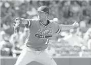  ?? [PHOTO BY SARAH PHIPPS, THE OKLAHOMAN] ?? Oklahoma State’s Carson Teel throws a pitch during the Big 12 Tournament championsh­ip game last May against Texas at Chickasaw Bricktown Ballpark.