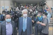  ?? KIN CHEUNG — THE ASSOCIATED PRESS ?? Pro-democracy activists Martin Lee, center, and Albert Ho, left, arrive at a court in Hong Kong on Friday.