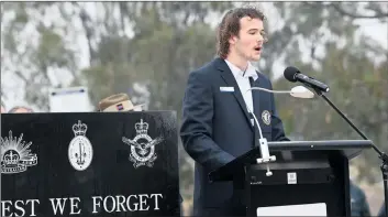  ?? ?? MEMORIES:
Horsham College’s Malachy O’brien addresses the dawn service gathering.