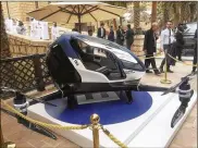  ?? AP ?? A model of EHang 184, a drone taxi displayed during the World Government Summit in Dubai, United Arab Emirates, in February 2017. Passengers drones are flying in Dubai and the concept will be tested at the Springfiel­dBeckley Municipal Airport this year.