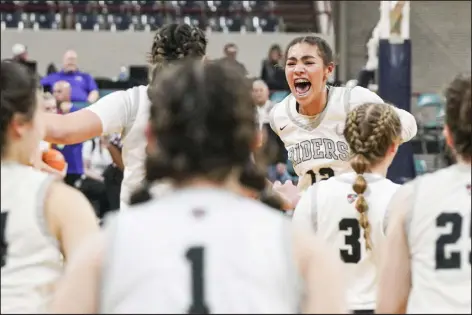  ?? REBECCA SLEZAK — SPECIAL TO THE DENVER POST ?? Roosevelt’s Kyla Hollier ( 12) cheers as time runs out in the fourth quarter and the Rough Riders win the girls Class 5A state championsh­ip game against Windsor at Denver Coliseum on Saturday.