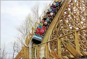  ?? COURTESY OF KINGS ISLAND ?? Kings Island’s new 109-foot-tall wooden coaster Mystic Timbers features 16 airtime moments through wooded terrain along 3,265 feet of track at speeds up to 53 mph.