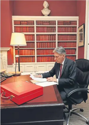  ??  ?? JUGGLING ACT: Chancellor Philip Hammond prepares for his Budget speech