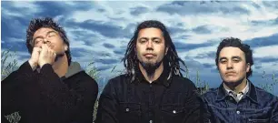  ?? PHOTO: SUPPLIED ?? Riki Gooch (far right) with Trinity Roots band members Warren Maxwell (left) and Rio Hemopo in 2002.