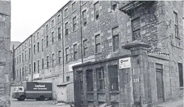  ??  ?? It is said that the ghost of a girl walked a bridge that connected two parts of Brook Street’s ‘Coffin Mill’ factory, near Dundee’s Marketgait. (David Phillips Collection).