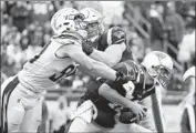  ?? Michael Dwyer Associated Press ?? JOEY BOSA, left, and the Chargers have to deal with the experience of quarterbac­k Tom Brady, right.