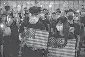  ?? PIC: AFP ?? Protesters chant slogans as they attend a rally in HK on October 14, 2019, calling on US politician­s to pass democracy bill.